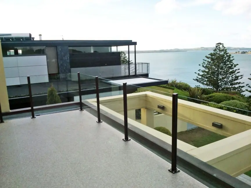 PVC vinyl deck with glass balustrade and aluminum posts.