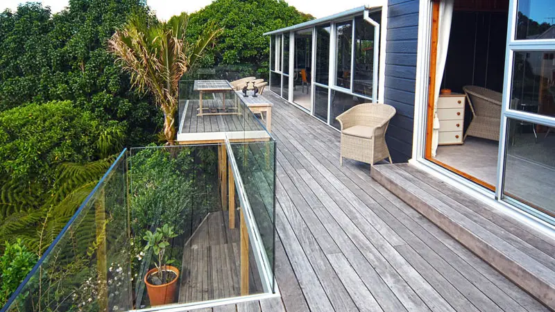 Pine deck with frameless glass balustrades.